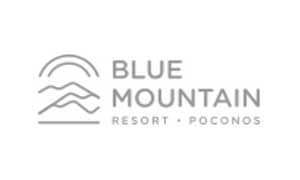 Logo for Blue Mountain Resort Poconos, featuring stylized mountain lines under a curved line, with the name and location in uppercase letters.