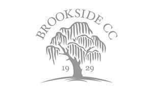 Logo for Brookside Country Club featuring a stylized willow tree with "BROOKSIDE CC" above and "1929" below the tree on a white background.